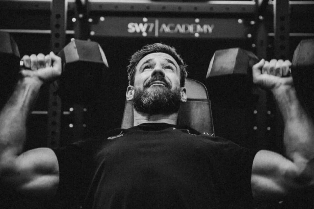 Man pushing weights.