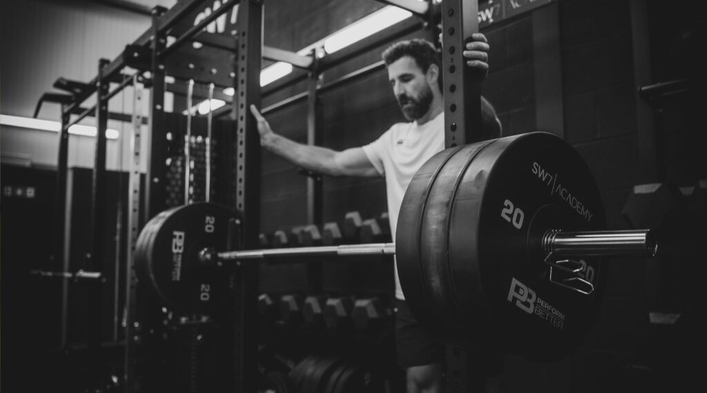 Man at barbell.