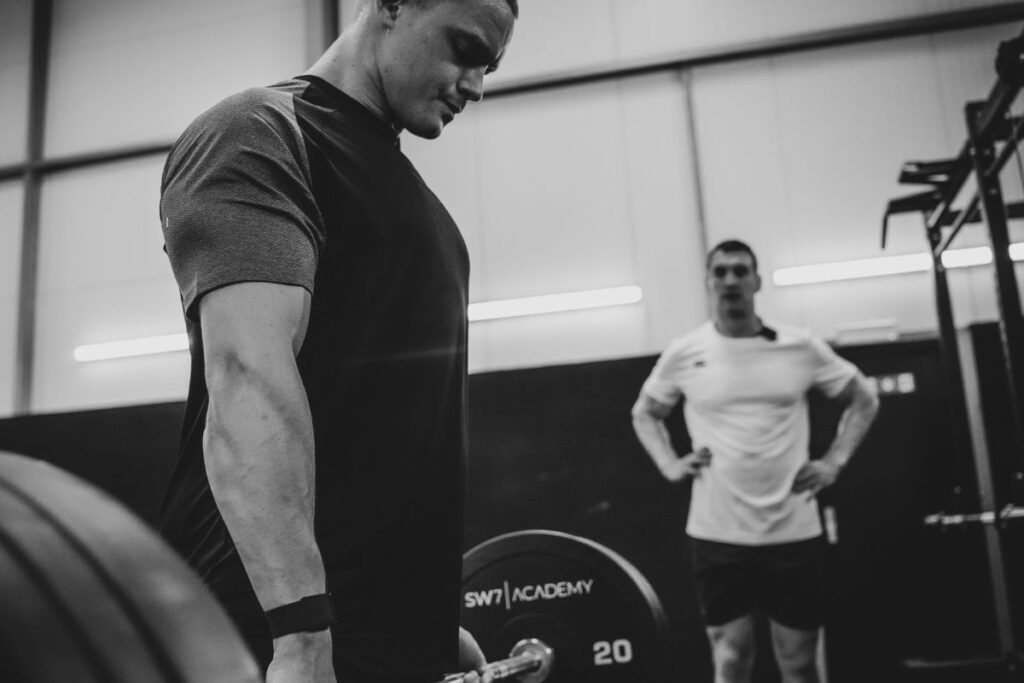 Man using barbell.