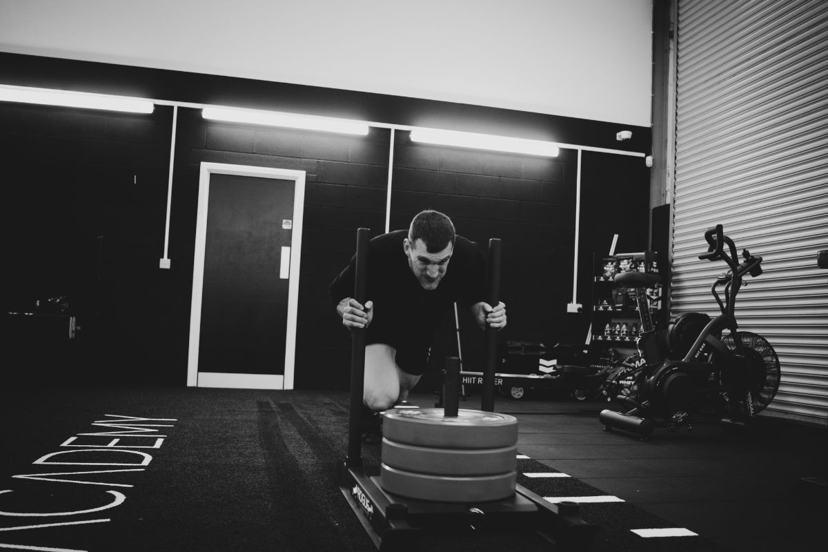 Sam Warburton using weight sledge in the gym.