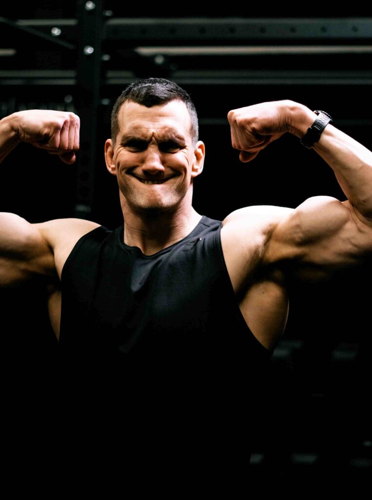 Sam Warburton flexing his biceps.