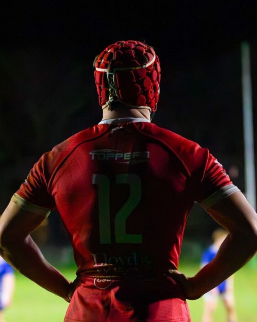 Charlie playing for the Scarlets after improving strength, speed and performance through a professional rugby training programme
