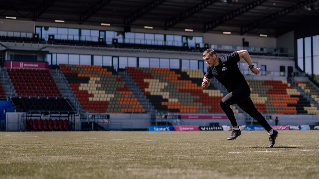 Sam Warburton sprinting during a rugby match showing explosive speed, power and elite athletic performance